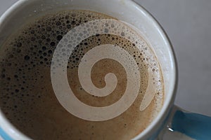 FinelyÃ¢â¬â¹ bubbleÃ¢â¬â¹ ofÃ¢â¬â¹ hotÃ¢â¬â¹ coffeeÃ¢â¬â¹ inÃ¢â¬â¹ aÃ¢â¬â¹ ceramicÃ¢â¬â¹ cupÃ¢â¬â¹ with copy space. photo